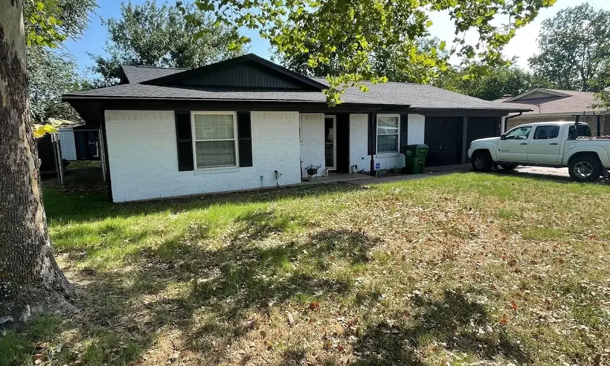 Professional roofing crew working on a residential roof in Ranson corporation